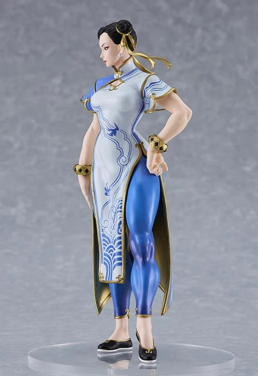 Side perspective showcasing sculpted hair and outfit
