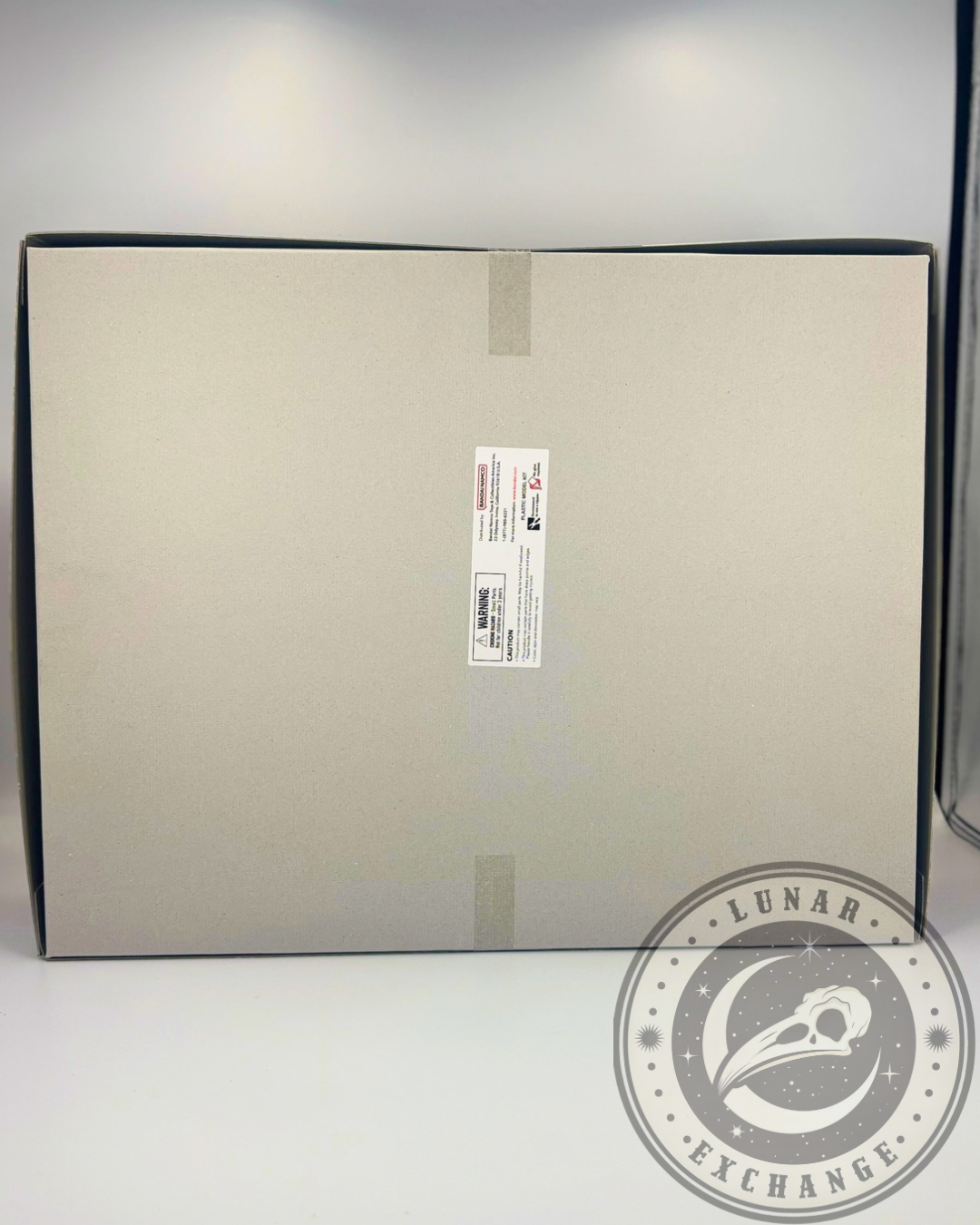 Back view of the KaiserGreymon model kit box with detailed product specs, safety warnings, and assembly preview images in Japanese.