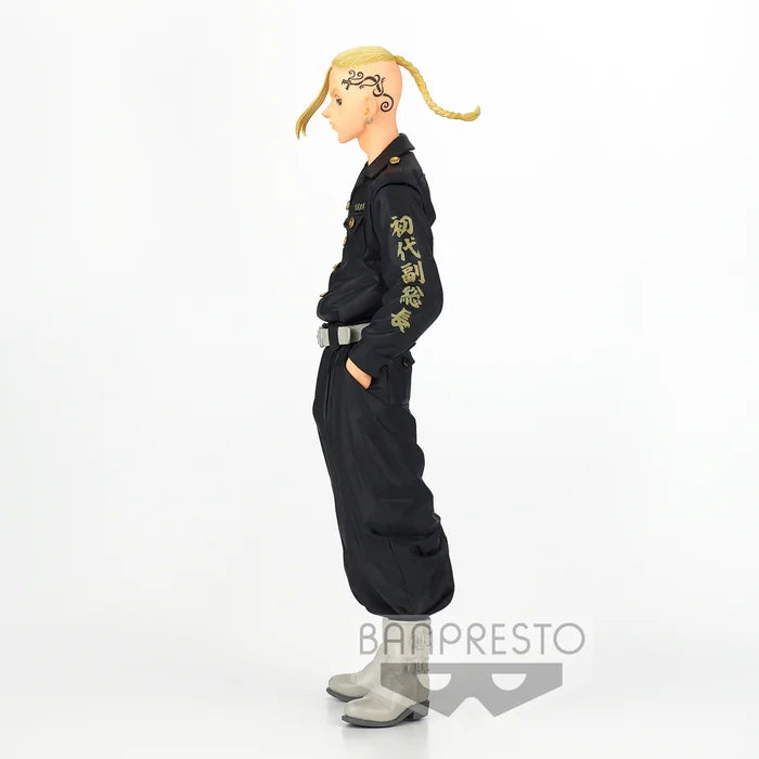 Side view showing Toman uniform details and hands-in-pockets pose.