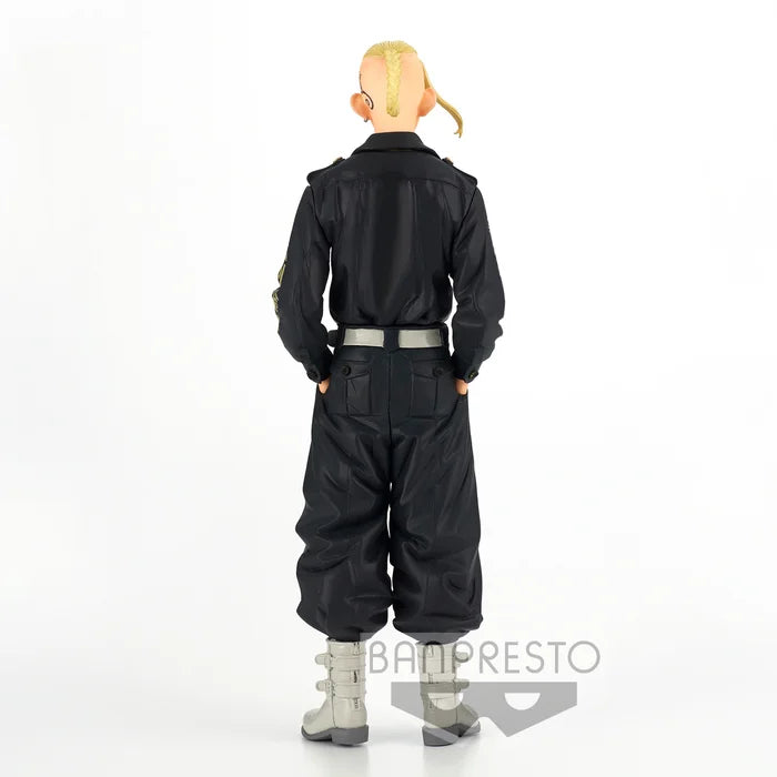 Back view showing Toman uniform details and hands-in-pockets pose.