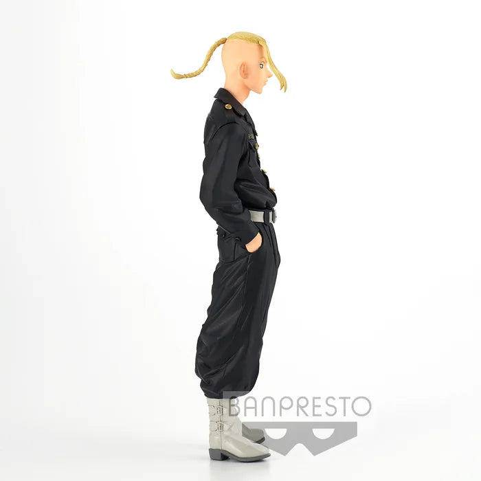 Side view showing Toman uniform details and hands-in-pockets pose.