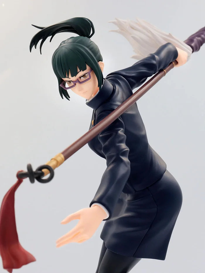 Close-up of Maki’s determined expression and glasses detail.