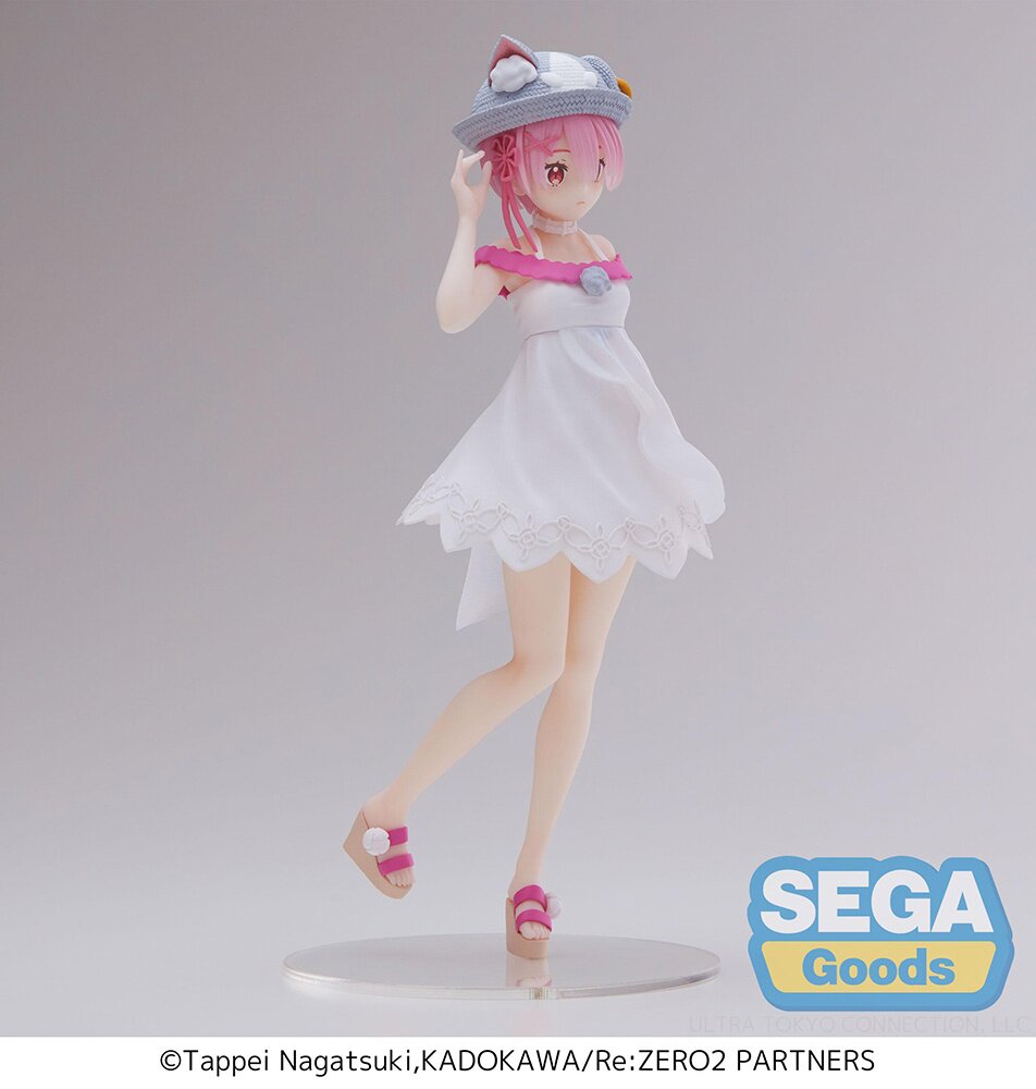 Side profile showcasing Ram's cat-ear straw hat and flowing dress.