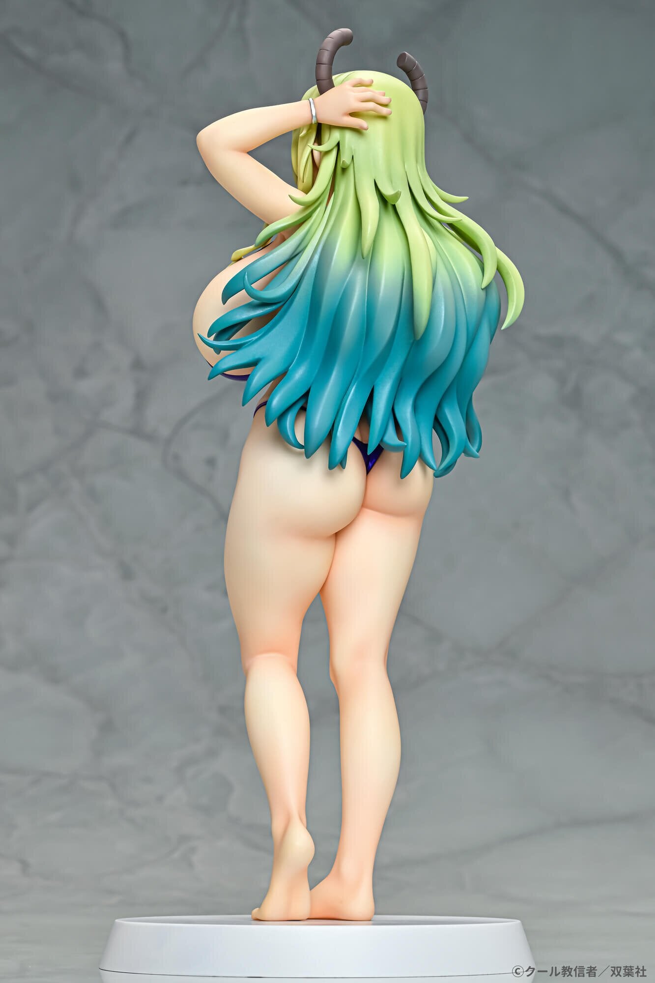 Rear angle highlighting the craftsmanship of Lucoa’s figure.