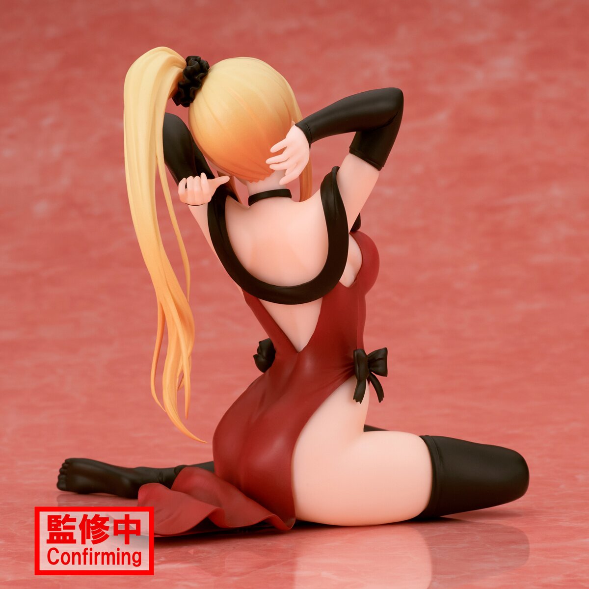 Rear view displaying the figure's sculpted hair and clothing details.