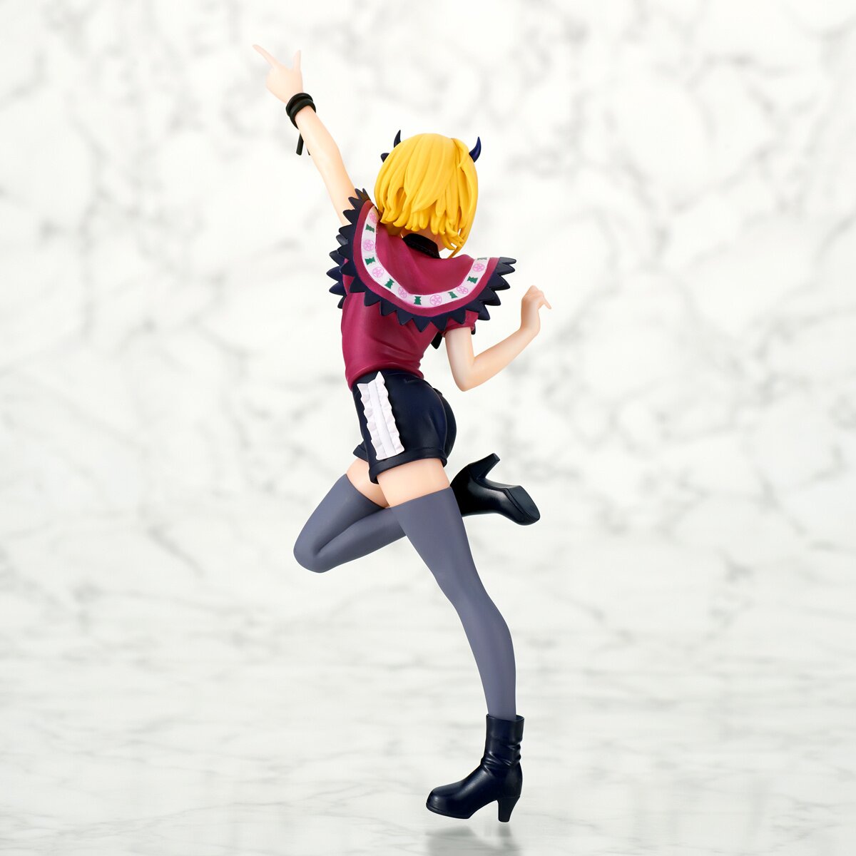 Side profile showcasing Mem-Cho's dynamic pose and outfit details.
