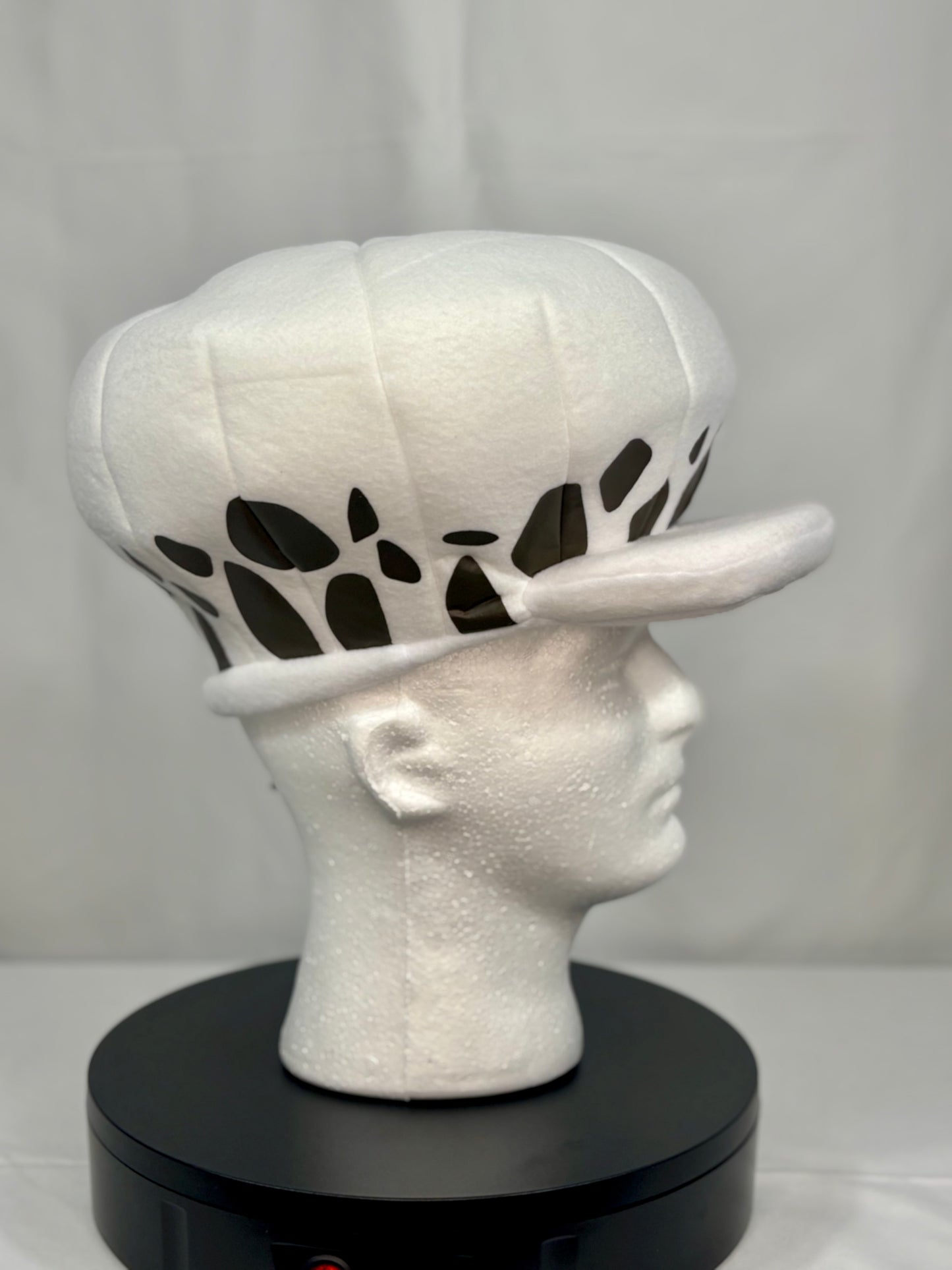 Side angle showing cow-print brim detail