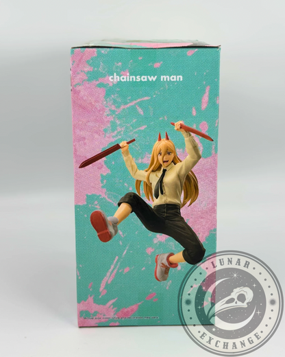 Side of the figure’s packaging featuring the Power figure in mid-air with swords, styled on a pink and teal backdrop.