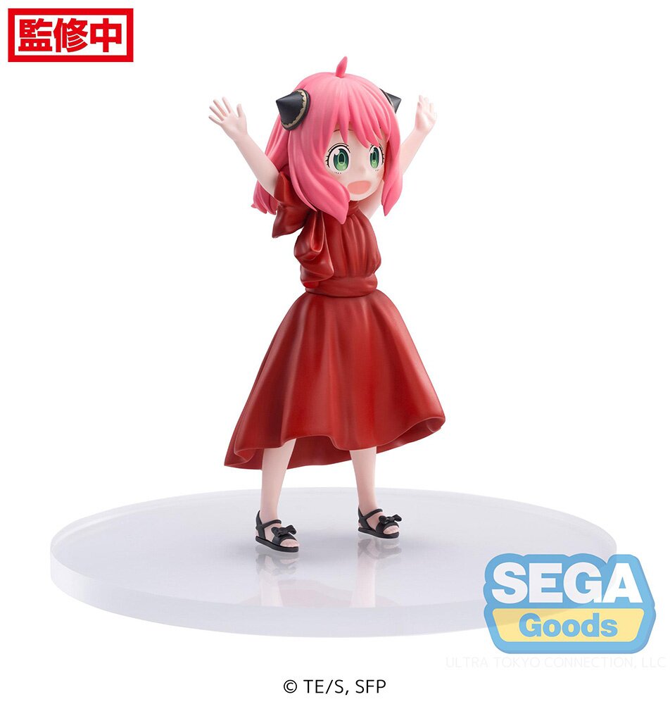 Side profile showcasing Anya's red dress and raised arms.