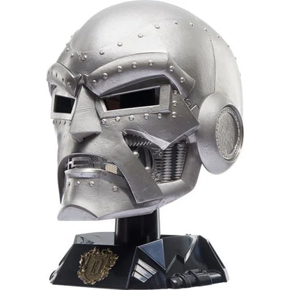 Hasbro Doctor Doom helmet displayed on a black base stand without the hood.