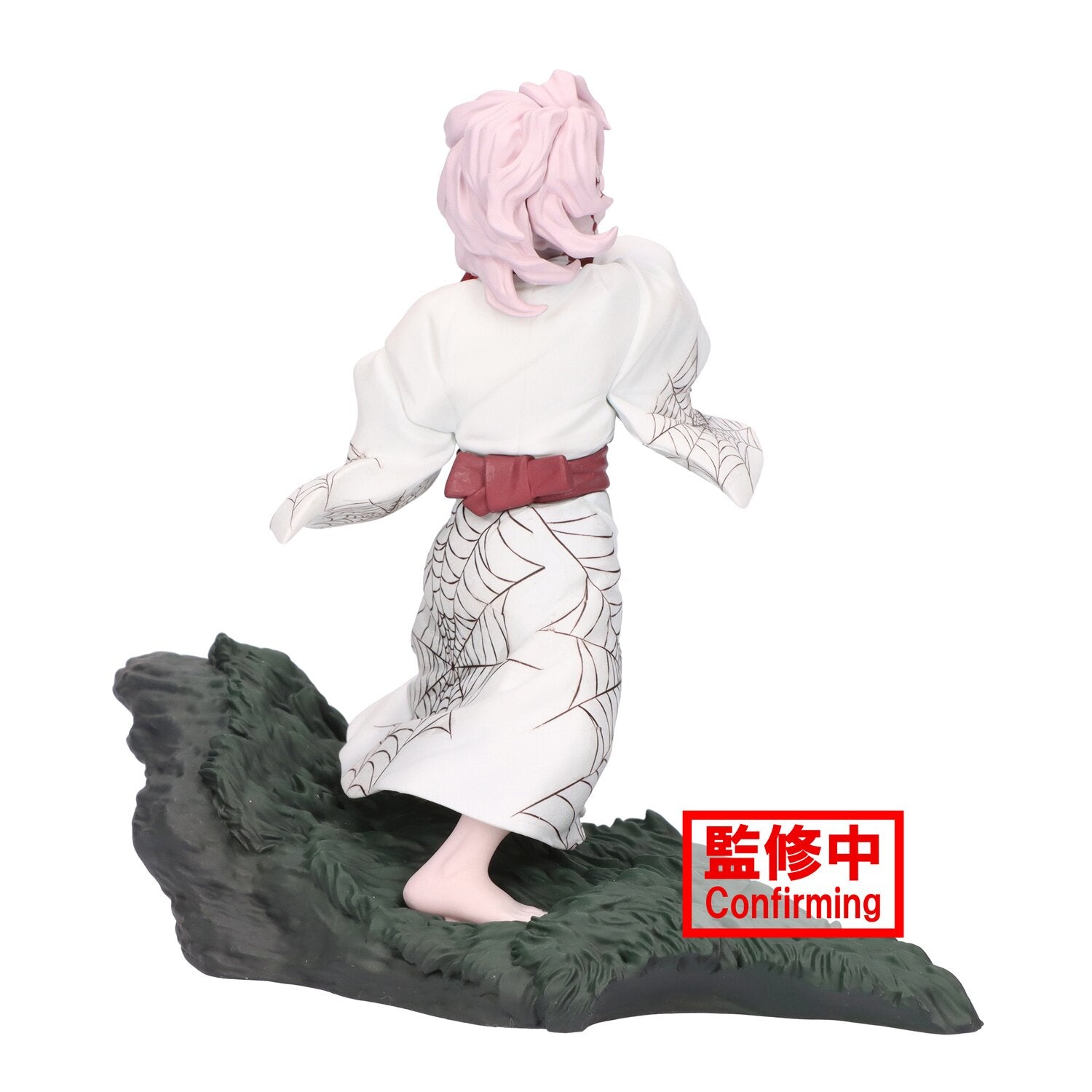 Rear view displaying the figure’s sculpted hair and flowing attire.