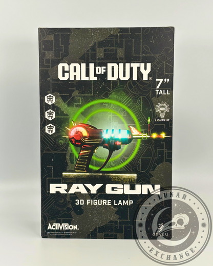 Front view of the Call of Duty Ray Gun 3D Figure Lamp packaging showing the LED-lit collectible design, product branding, and 7-inch height detail.