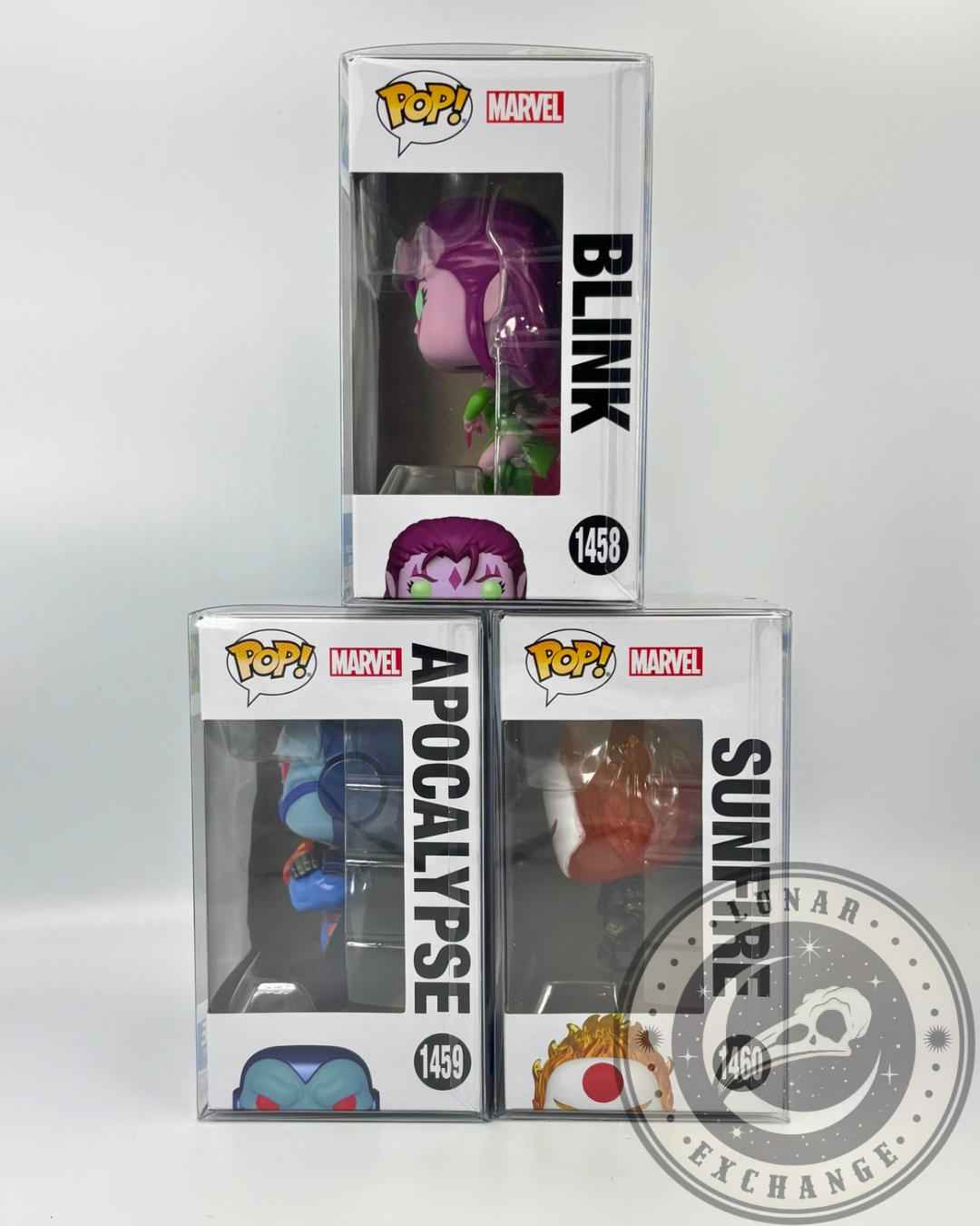 Side view of Funko Pop! Marvel X-Men boxed figures Blink (#1458), Apocalypse (#1459), and Sunfire (#1460), clearly showing names and character side art through the protective cases