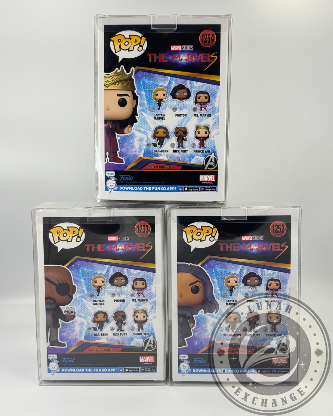 Rear packaging view of The Marvels Funko Pop! boxes showing collectible set: Captain Marvel, Photon, Ms. Marvel, Dar-Benn, Nick Fury, and Prince Yan.