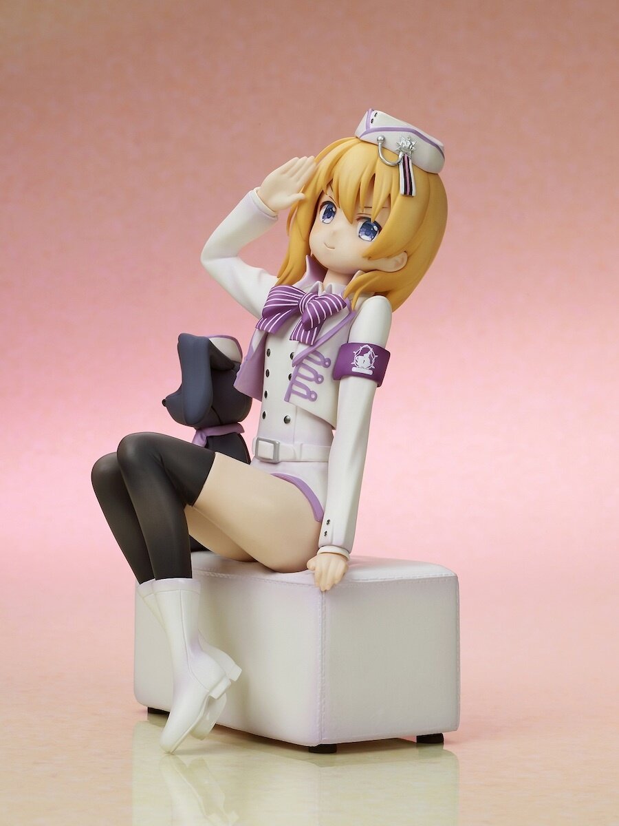 Side angle showcasing Cocoa’s seated pose and uniform details.