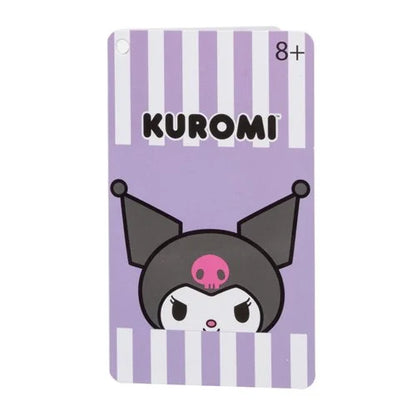Front of the product tag for the Sanrio Kuromi Loungefly mini-backpack, featuring Kuromi’s face peeking up from purple and white vertical stripes with an age rating of 8+.