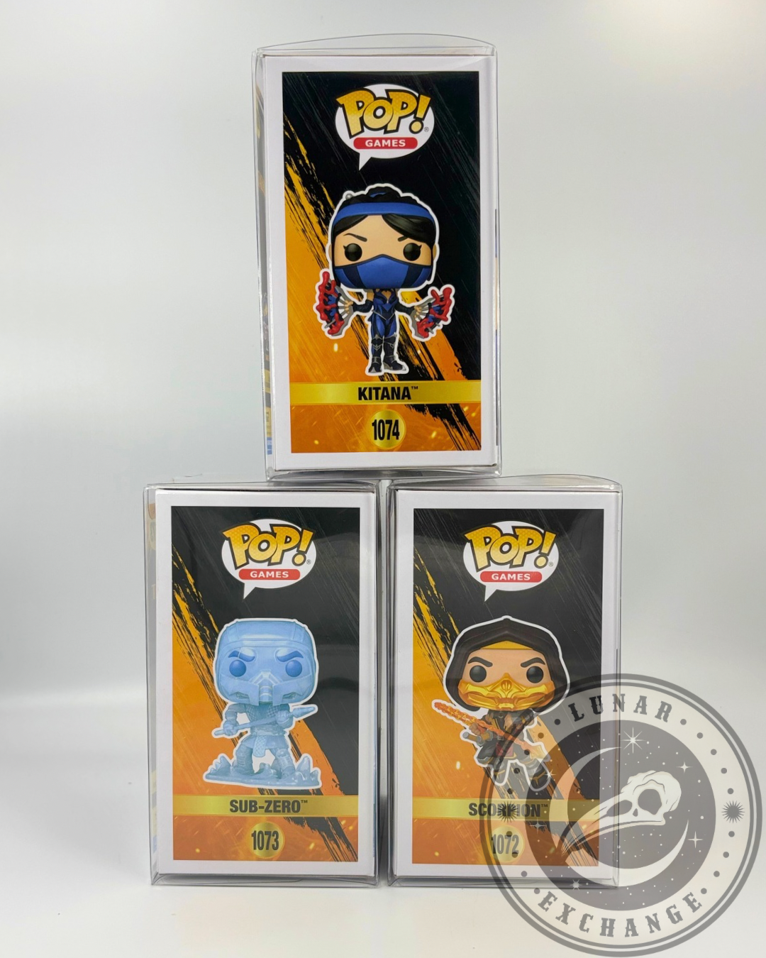 Side panel artwork of Mortal Kombat 11 Funko Pop! vinyl figures featuring Kitana (#1074), Sub-Zero (#1073), and Scorpion (#1072) in protective hard cases with Lunar Exchange branding.