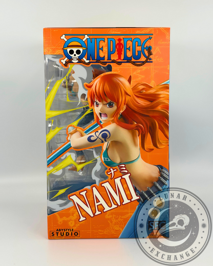 Side panel of the Nami figure box featuring a close-up image of the figure and One Piece branding with bright orange and yellow accents.