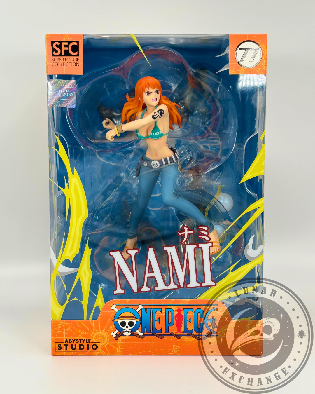 Front of the Nami SFC figure box by ABYstyle Studio, showcasing the figure in a dynamic pose through the clear window packaging.