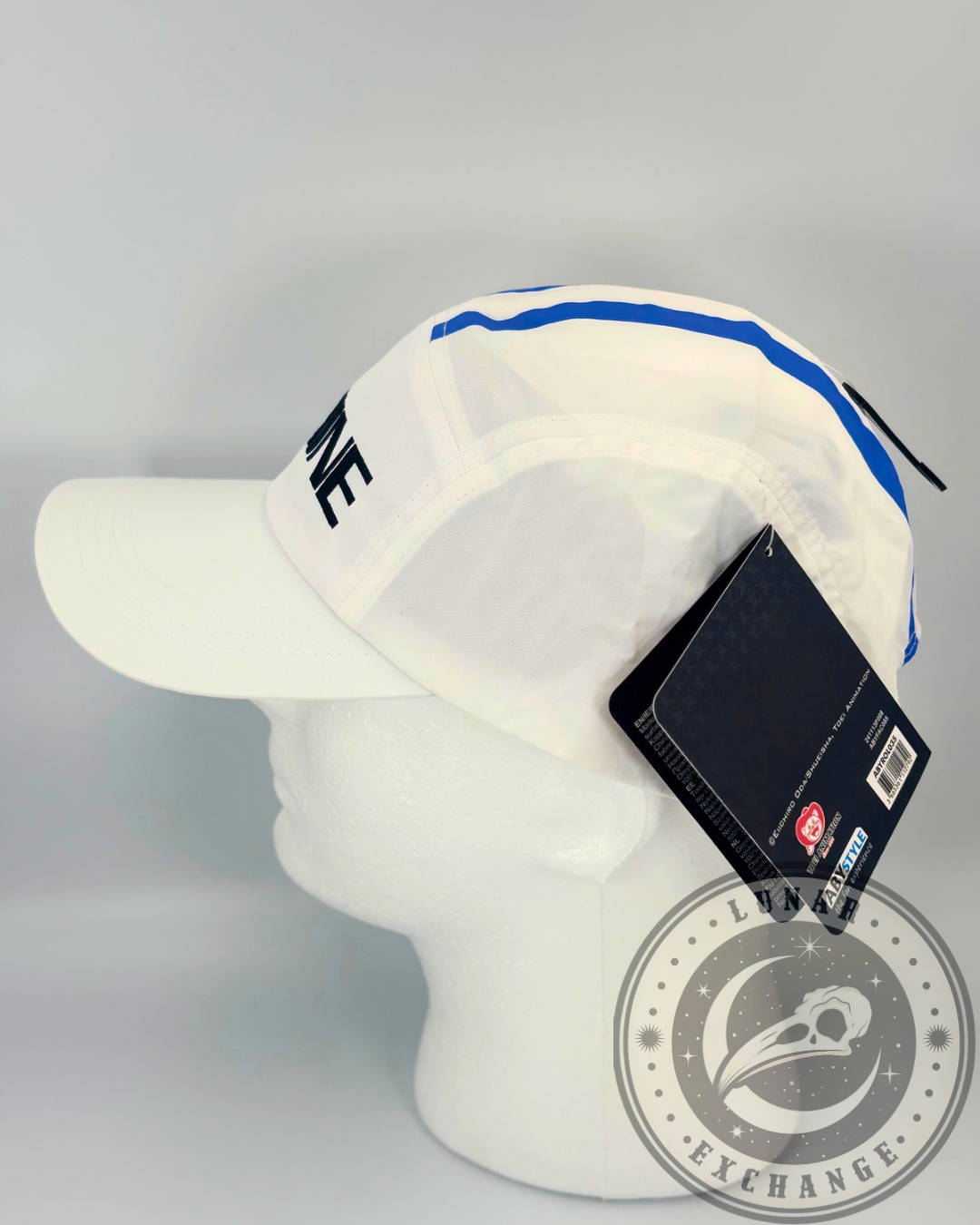 Side view of the One Piece Marine cap worn on a mannequin, showing product tags and Lunar Exchange branding.