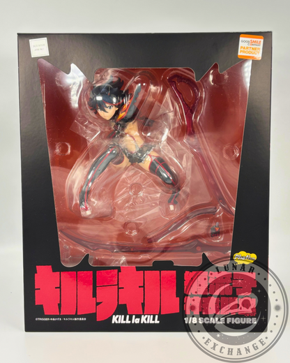 Front view of the boxed figure showing Ryuko Matoi visible through the clear display window of the retail packaging.