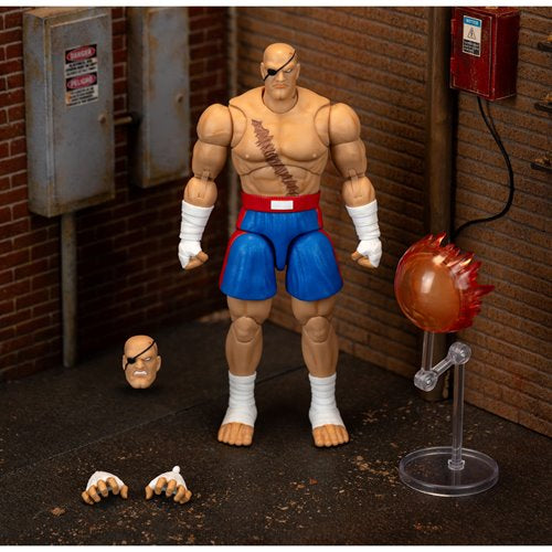 Complete Sagat action figure set including alternate head, hands, and energy effect display stand.