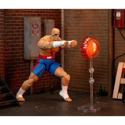 Sagat action figure posed mid-attack with Tiger Shot energy effect on stand.