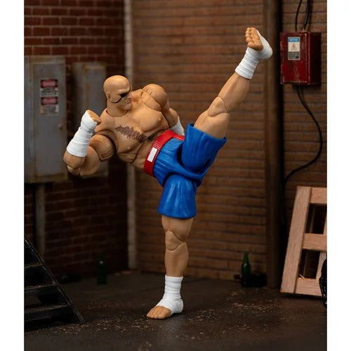 Sagat figure posed in mid-air high kick showing full articulation.
