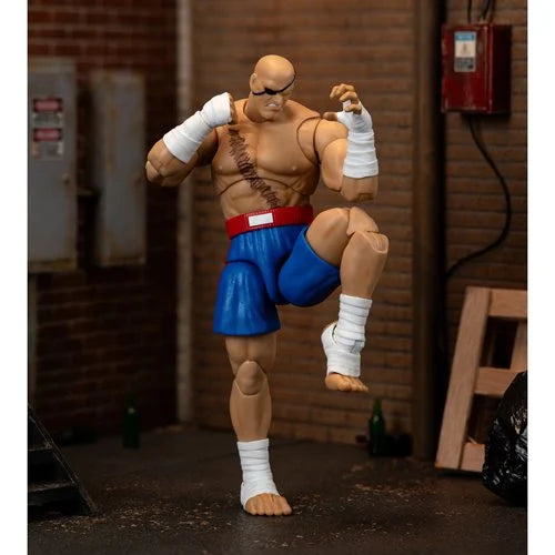 Sagat action figure executing a knee strike pose.