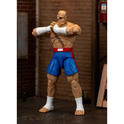 Sagat action figure posed ready for battle with arms crossed.