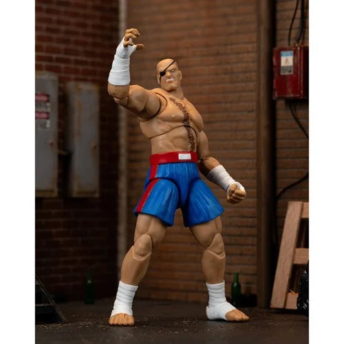 Sagat action figure with raised hand and fierce expression in dramatic street scene.