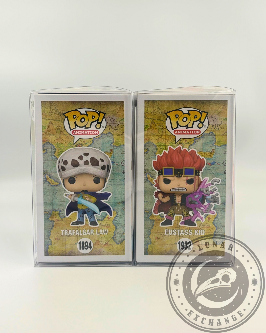 Side panel view of Funko Pop! One Piece figures Trafalgar Law #1894 and Eustass Kid #1932 with anime-style art and One Piece branding