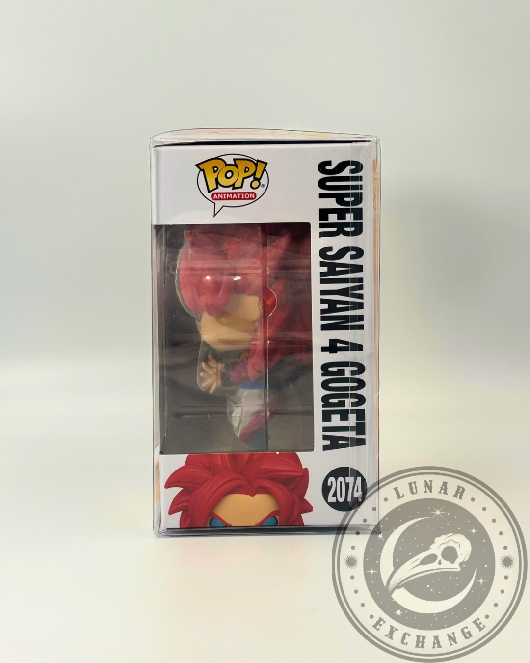 Side profile of the Super Saiyan 4 Gogeta #2074 Funko Pop! box showing window view of the figure inside and bold black vertical text along the side panel.