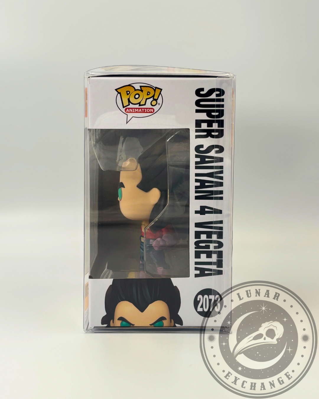 Side view of Super Saiyan 4 Vegeta Funko Pop! #2073 box with clear display of character name, figure inside the protector, and top corner branding.