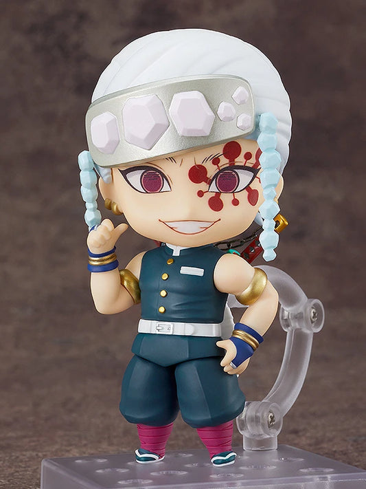 	Close-up of Tengen Uzui Nendoroid smiling face plate with gem headdress.
