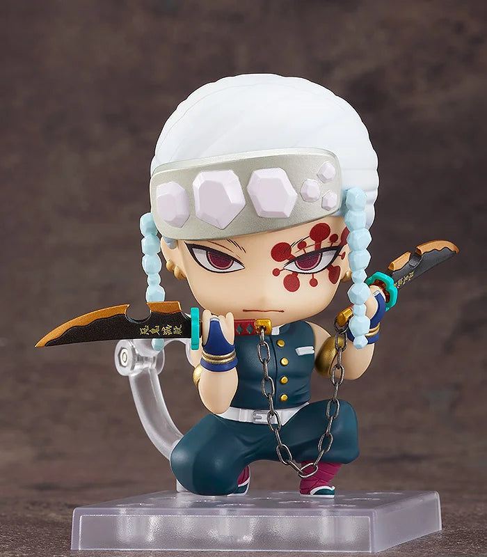 Nendoroid Tengen Uzui figure from Demon Slayer in flashy pose with weapons.